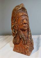 Front angle showing detailed facial features and eagle headdress.