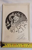 Frontal image of the lithograph showing the full artwork, hand-signed number 582/1000 and signature dated 1982, with measuring tape indicating approx 7 inches width.