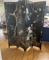 Front view showing intricate floral and nature-themed hand-painted designs across five black lacquered wooden panels, standing 6 feet tall.