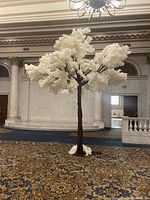 Full view of single faux cherry blossom tree showing trunk and canopy