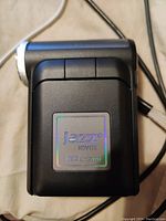 Front view of a Jazz HDV178 digital camcorder showing holographic logo and HD label