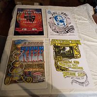 Four colorful classic rock reprint posters laid flat on a surface, displaying The Grateful Dead, Zig Zag - Big Brother and the Holding Company, A Puff of Keif, and William Tell and the Marksmen posters.