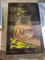 Image of sealed Monet 1000 piece jigsaw puzzle box from Fine Art collection featuring The Parc Monceau painting by Monet.
