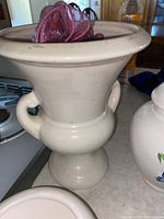Large white vase with flared rim and two side handles