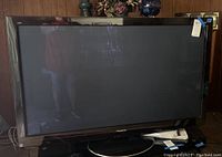 Front view of Panasonic 50 inch TV showing screen and stand.