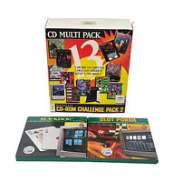 Front view of Mindscape CD-ROM Challenge Pack 2 multi-pack box along with Blackjack and Slot Poker game boxes showing artwork and titles