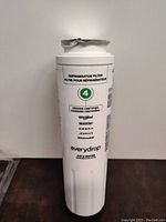 Front view of white cylindrical refrigerator water filter cartridge labeled with number 4 and compatible brand names.
