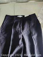 Front view of black Cleo trousers size 8 showing fabric texture, crease, and waist details.