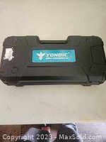 Black hard plastic carrying case with Yongic label on top.