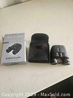 Photo showing Occer binoculars, black carrying case, and original product box on a white surface.