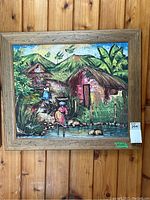 Framed original acrylic painting on canvas depicting a rural scene with mountains, houses, and people.