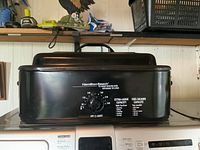 Hamilton Beach 18 qt roaster oven front view showing controls and brand