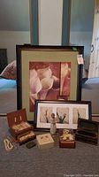 Overall group photo showing all items including framed prints, figurine, jewellery boxes, costume jewellery, and wristwatch.