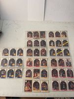 Full layout of several basketball cards on a table showing multiple players arranged in rows.