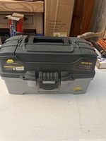 Closed Plano fishing tackle box on a table