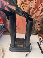 Front view of Peet electric boot and shoe dryer with four tall drying tubes and one shorter glove attachment.