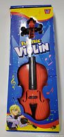 Front view of the boxed child's electronic violin showing violin inside and colorful packaging with musical notes.