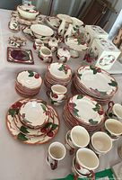 Overall table layout showing all dinnerware, glassware boxes and serveware