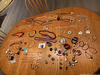 Overview of all assorted jewelry pieces on table