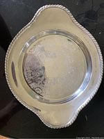 Photo showing electroplated copper tray trophy with engraved floral pattern and inscription for the 1967-68 Town of Mount Royal Curling Club Cribbage Award