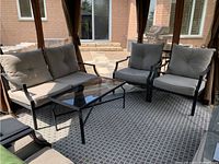 Full set: two armchairs, loveseat and coffee table under gazebo