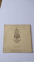 Back cover of A Foot in Coldwater vinyl sleeve showing tracklist and record label's production logo.
