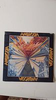 Front cover of Ambrosia self-titled vinyl album with symmetrical colorful abstract geometric artwork.