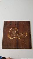 Front cover of the 1972 Chicago vinyl record showing wood panel design with gold Chicago logo.