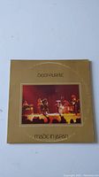 Front cover of the Deep Purple 'Made in Japan' vinyl album sleeve with concert photo and title.