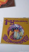 Front album cover with psychedelic artwork and band photo