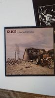 Front cover album artwork for Rush - A Farewell to Kings, showing industrial demolition scene with workers and rubble