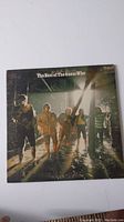 Front cover of The Best of The Guess Who vinyl record showing band members in a moody backlit setting.