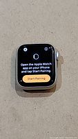 Front view showing pairing screen on display