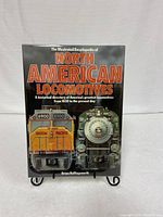 Front cover of the book showing title and locomotive images, including Union Pacific engine 6900 and another steam locomotive, displayed on a stand.