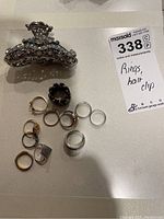 Full lot image showing all rings and the hair clip together on a neutral surface