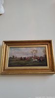 Overall view of framed painting showing hunting scene