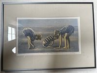 Framed print depicting three children on the beach, signed by Gerald Hardy, titled "Beach Boys & Shells."