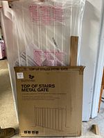 Photo showing the original boxed product of Summer Top of Stairs Metal Gate in white, unopened and including all parts as per seller description.