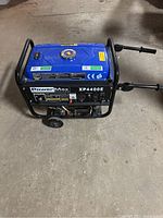 Front-side view of generator in frame with wheels and handles
