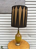 Full view of Mid Century Modern table lamp showing ceramic base and geometric patterned shade