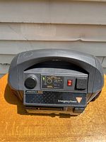 Front view of XPower Powerpack 300 showing handle, control panel with switches and indicator lights, and labels.