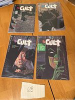 Front covers of four Batman The Cult comic books issues 1-4, displaying cover artwork.