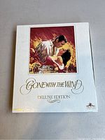 Front of white slipcase featuring Gone With The Wind artwork and Deluxe Edition title
