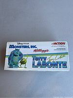 Top of the original box with Disney-Pixar Monsters Inc., Kelloggs, and Racing Champions Action logos, indicating limited edition Terry Labonte collectible stock car.