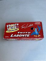 Red Action branded box with Kelloggs Froot Loops and Terry Labonte signature on top, showing the packaging for the collectible.