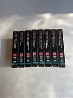 Photo of 8 Beta video tapes of Star Trek Original Series episodes numbered 18 to 25, showing side spines with episode numbers and Star Trek branding.