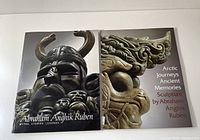 Photo showing the two hardcover art books side by side featuring Inuit artist Abraham Anghik Ruben's sculptures on covers