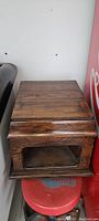 Photo of the antique wooden gramophone box showing the top and glass front panel.