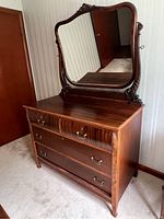 Full view of the Victorian dresser with attached mirror showing wood finish and carved details.