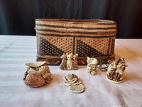 Antique basket with 5 animal and fruit Harmony Kingdom figurines in front